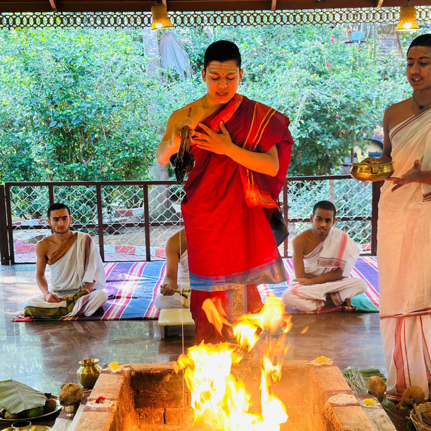 Students performing Yajna rituals