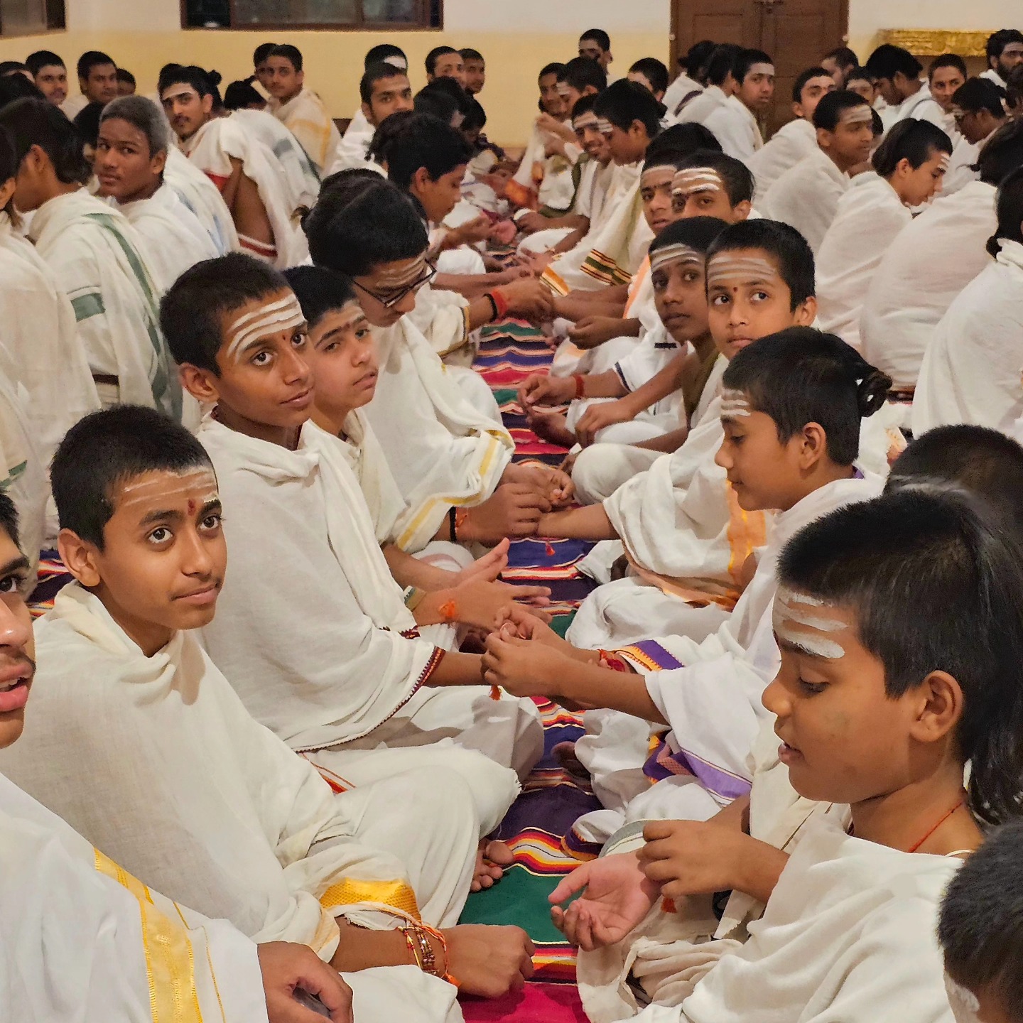Students seated in rows for chanting